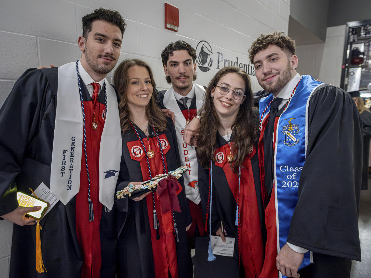 The Povolos quintuplets, from left; Marcus, Victoria, Michael, Ashley and Vico pose for a photo during the commencement ceremony at the Montclair State University on Monday.