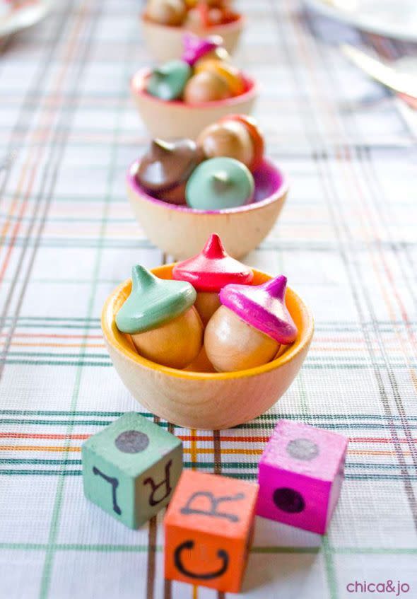 <p>You can get the kids to help make the pieces for this game, a colorful take on the easy dice contest "Left Center Right," or just let them roll with it at the children's table.</p><p><strong>Get the tutorial at <a href="https://www.chicaandjo.com/thanksgiving-kids-table-game/" rel="nofollow noopener" target="_blank" data-ylk="slk:Chica and Jo;elm:context_link;itc:0;sec:content-canvas" class="link ">Chica and Jo</a>.</strong></p><p><a class="link " href="https://www.amazon.com/Wooden-Acorns-Counting-Sorting-Kit/dp/B076R5NKX4/ref=as_li_ss_tl?tag=syn-yahoo-20&ascsubtag=%5Bartid%7C10050.g.1201%5Bsrc%7Cyahoo-us" rel="nofollow noopener" target="_blank" data-ylk="slk:SHOP WOODEN ACORNS SET;elm:context_link;itc:0;sec:content-canvas">SHOP WOODEN ACORNS SET</a></p>