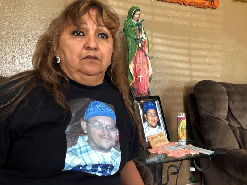 Erma Aldaba sits in her home, wearing a T-shirt emblazoned with the image of her son Johnny Leija, who died in hospital after a deadly encounter with the police, in Madill, Oklahoma