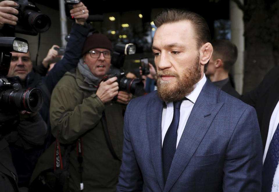 Conor McGregor leaves Dublin District Court in Dublin, Friday, Nov. 1, 2019. McGregor has been fined $1,120 for assaulting a man in a pub. The retired mixed martial arts fighter from Ireland pleaded guilty to a charge of assault during an appearance at Dublin District Court. The 31-year-old McGregor hasn't fought in MMA since losing by submission to Khabib Nurmagomedov in October 2018. (Brian Lawless/PA via AP)