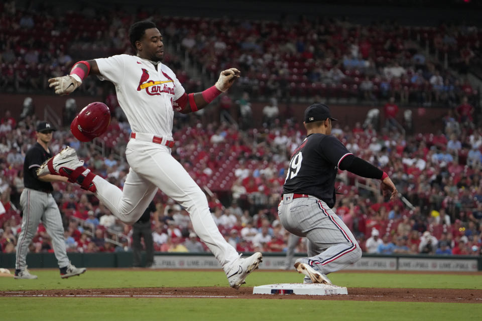 St. Louis Cardinals' Jordan Walker, left, grounds out as Minnesota Twins first baseman Donovan Solano handles the throw during the fourth inning of a baseball game Thursday, Aug. 3, 2023, in St. Louis. (AP Photo/Jeff Roberson)