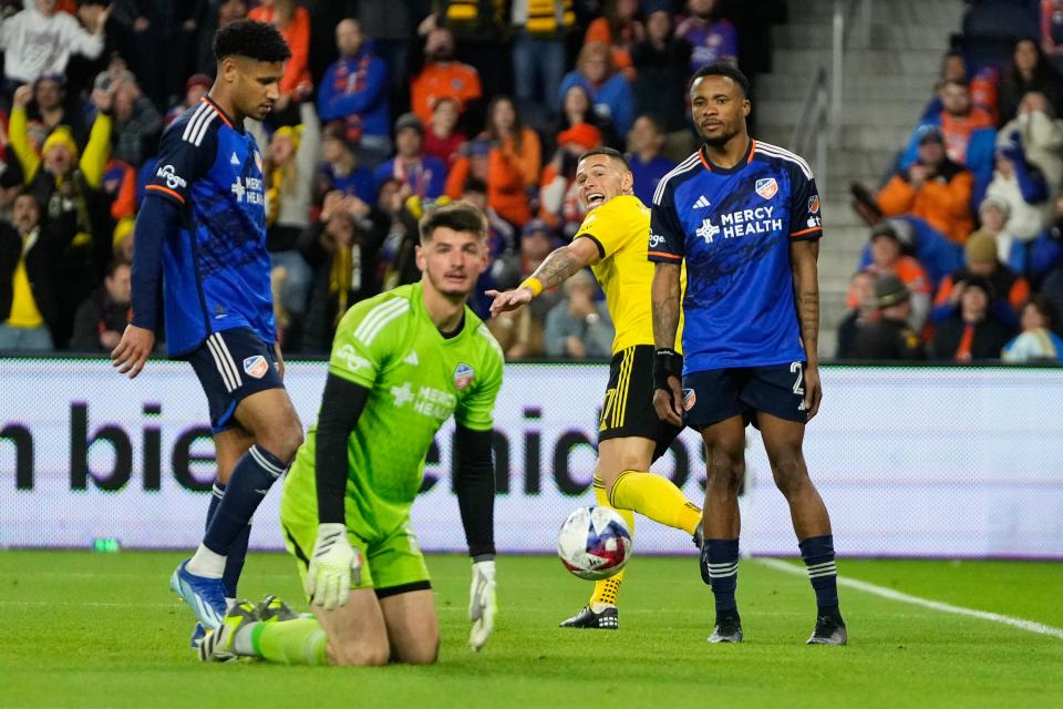 Dec 2, 2023; Cincinnati, Ohio, USA; Columbus Crew forward Christian Ramirez (17) celebrates scoring the game winning goal behind FC Cincinnati goalkeeper Roman Celentano (18) during the second half of the MLS Cup Eastern Conference Finals at TQL Stadium.