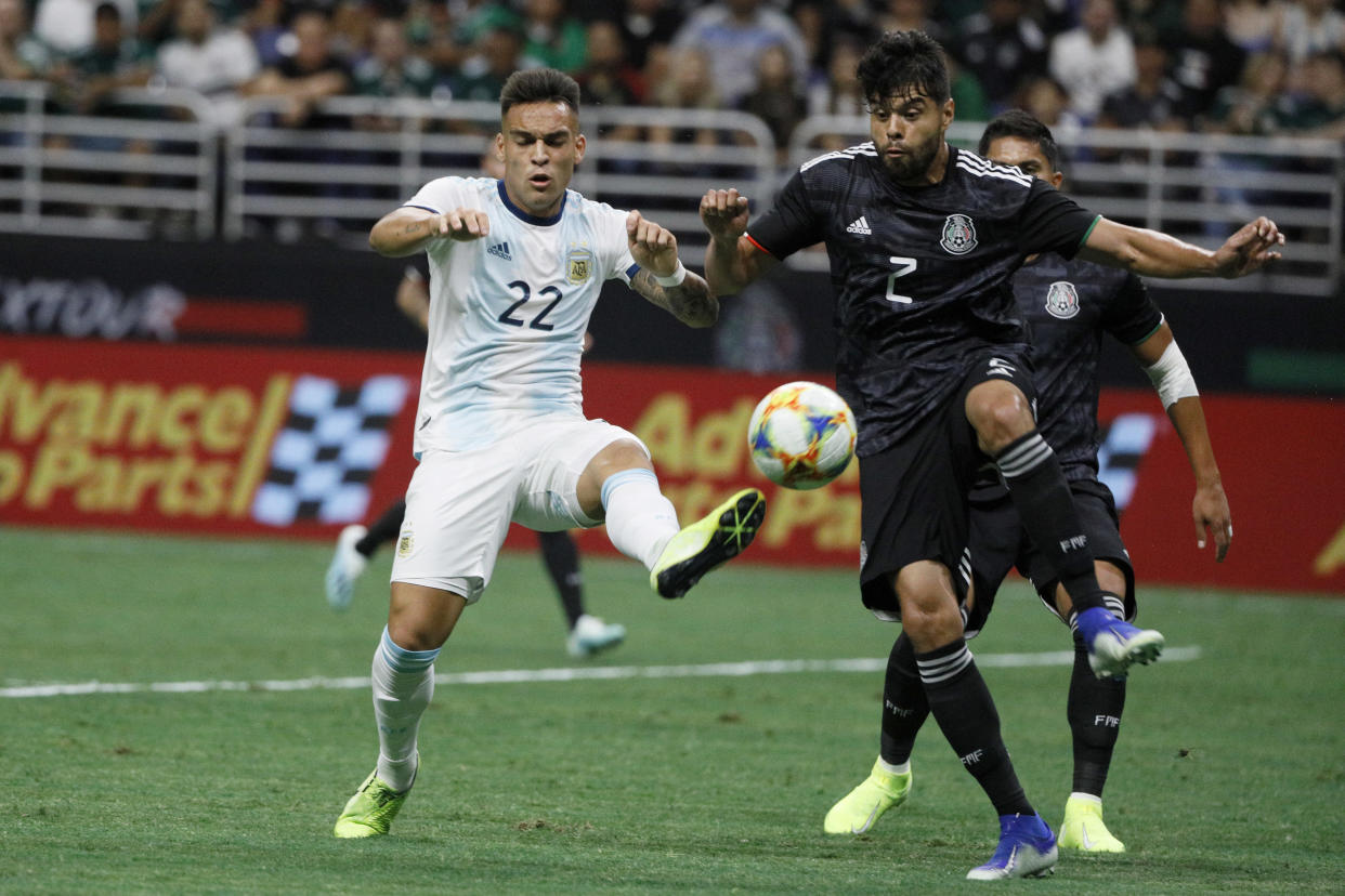 Sep 10, 2019; San Antonio, TX, USA; Argentina Lautaro Mart’nez (22) controls the ball against Mexico defender Nestor Araujo (2) at Alamadome. Mandatory Credit: Soobum Im-USA TODAY Sports