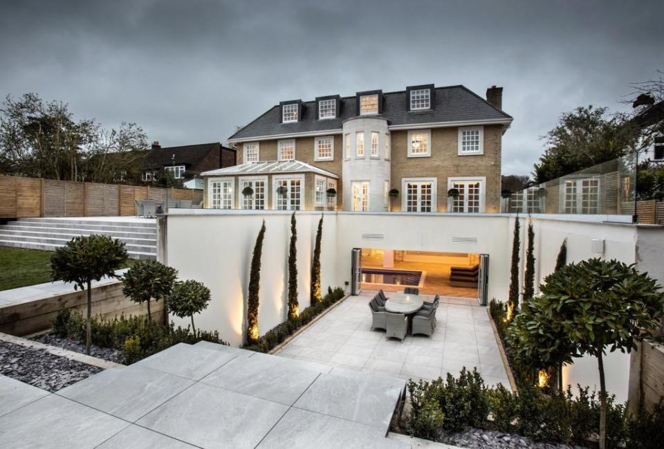 The tiered garden of this new build home has been designed with outdoor entertaining in mind (Statons)