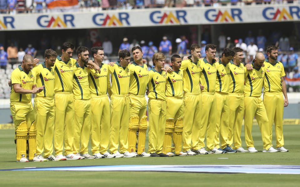 Australia's captain Aaron Finch, left, and teammates stand for the national anthem before the first one-day international cricket match between India and Australia in Hyderabad, India, Saturday, March 2, 2019. (AP Photo/Mahesh Kumar A.)