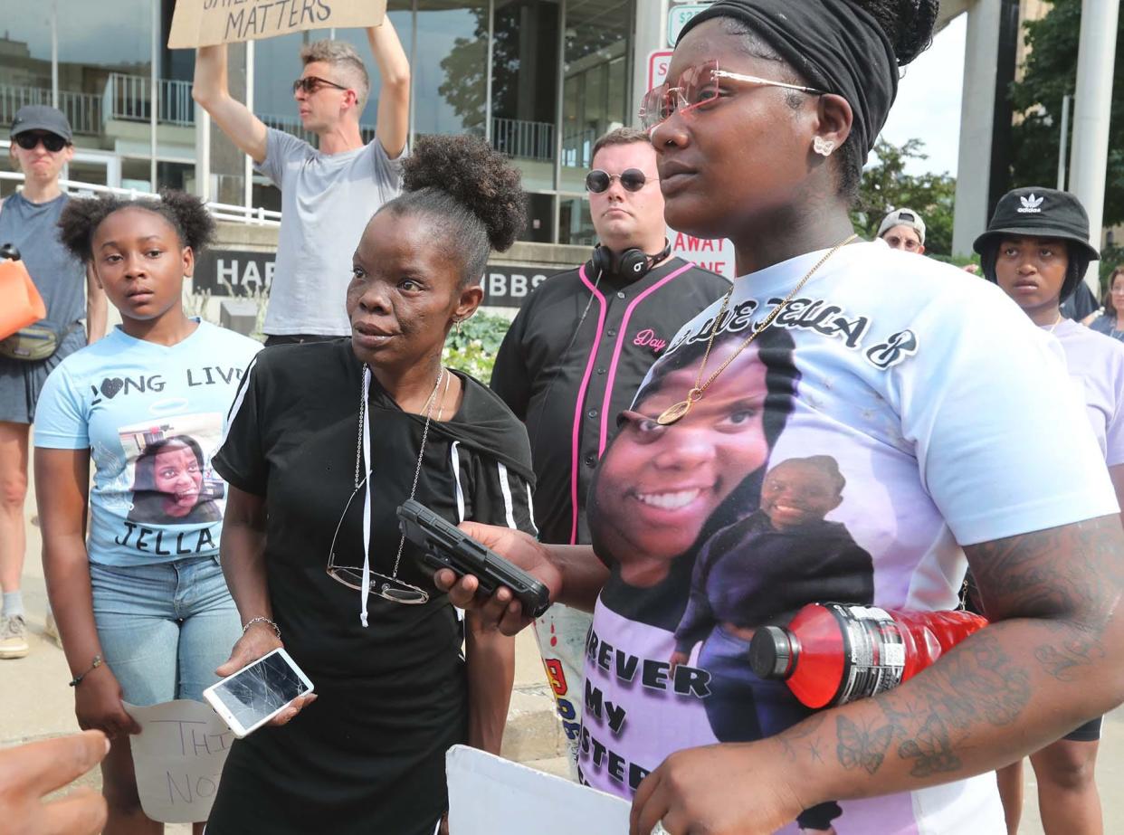 Shalesa Beasley, center, and her family members wear an image of her daughter Jaymeisha Beasley, the fiancée of Jayland Walker, during a protest in front of the Akron Police Department at the Harold K. Stubbs Justice Center on Friday, July 1, 2022, in downtown Akron. Beasley was struck and killed by a hit-skip driver in Cincinnati in May 2022, a month before Walker's death.