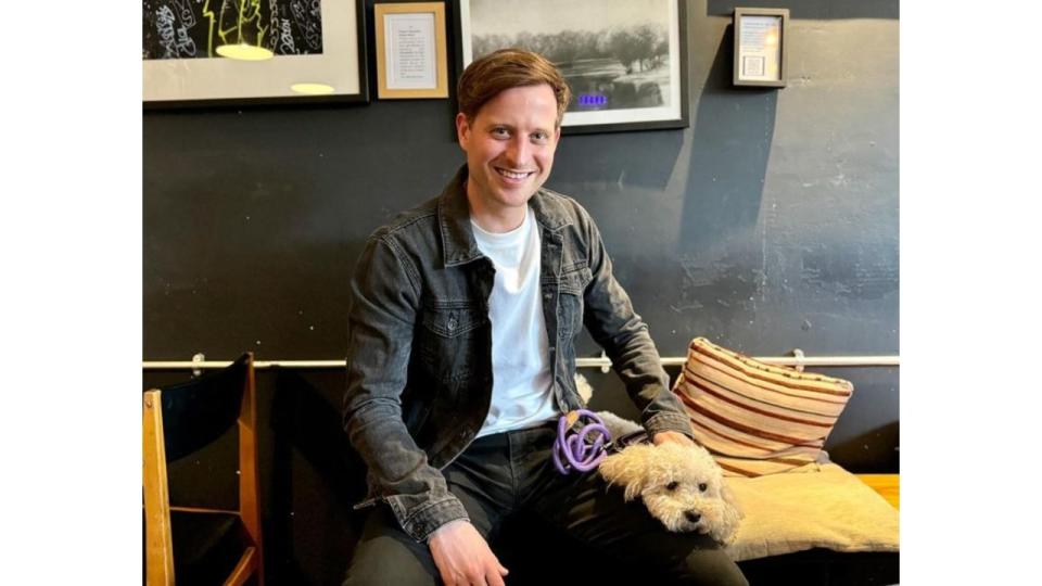 Nicholas Ralph with a dog