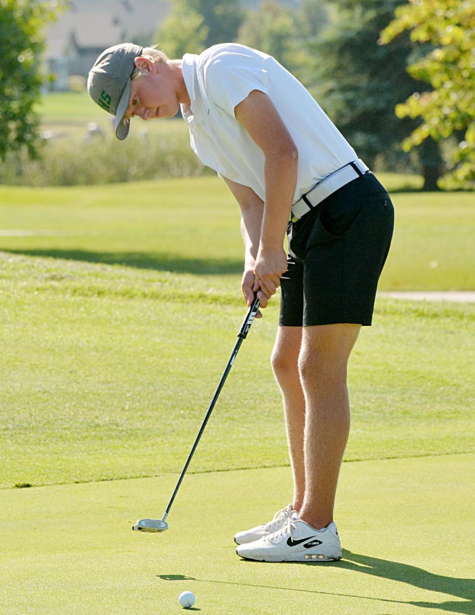 Aberdeen Roncalli's Sawyer Henrich putts on No. 4 Red during the Watertown Invitational boys golf tournament at Cattail Crossing Golf Course on Tuesday. Public Opinion by Roger Merriam