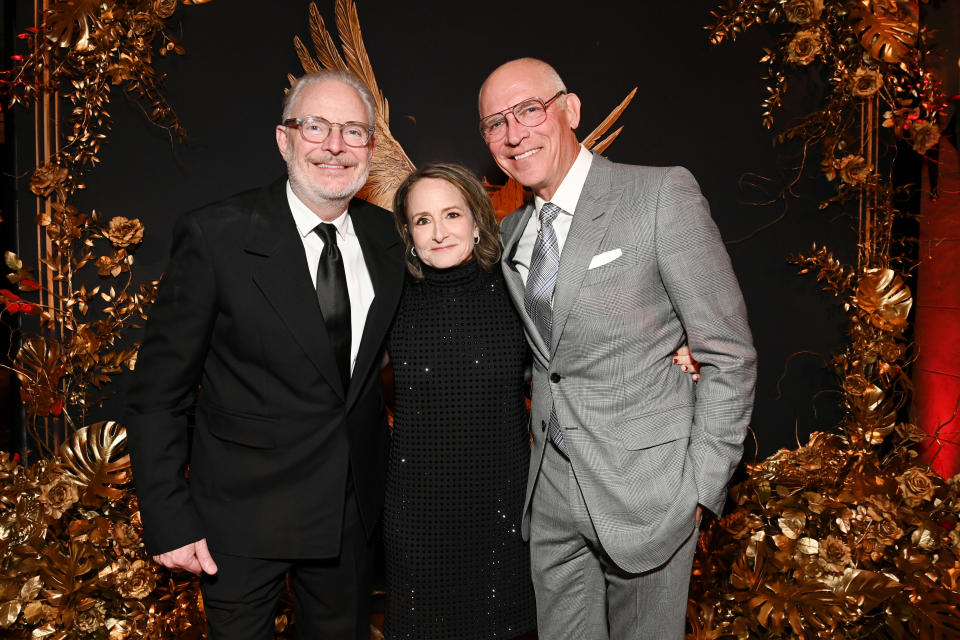 HOLLYWOOD, CALIFORNIA - NOVEMBER 13: (L-R) Francis Lawrence, Nina Jacobson, and Joe Drake, Chairman of Lionsgate Motion Picture Group & Co-chief Operating Officer of Lionsgate attend 