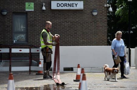 Safety equipment is checked at the Dorney Tower residential block, after residents were evacuated as a precautionary measure following concerns over the type of cladding used on the outside of the buildings on the Chalcots Estate in north London, Britain, June 26, 2017. REUTERS/Hannah McKay