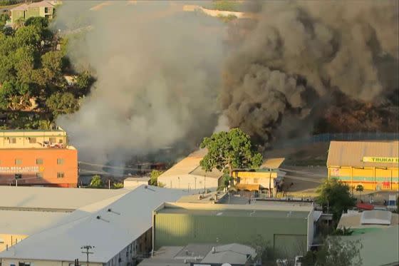 Smoke billowed from a building fire in Port Moresby amid the riots on Jan. 10, 2024.<span class="copyright">STR,AFP—Getty Images</span>