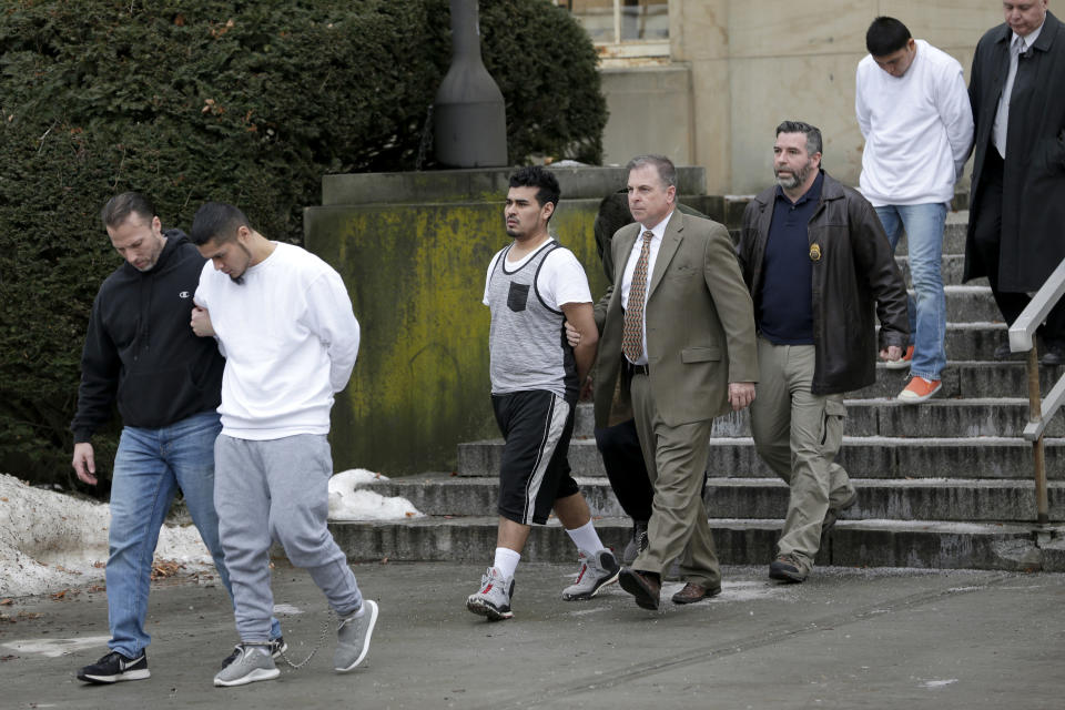 Suspected MS-13 members are escorted to their arraignment in Mineola, N.Y., on Jan. 11, 2018. (Photo: Seth Wenig/AP)