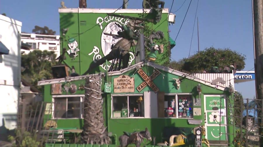 Patrick's Roadhouse is famous for its bright-green exterior and plenty of eye-catching kitschy sculptures. (KTLA)