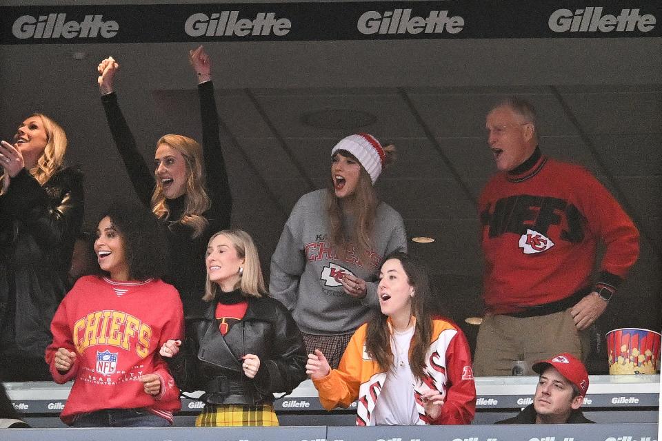 Taylor Swift and Brittany Mahomes cheer at a football game