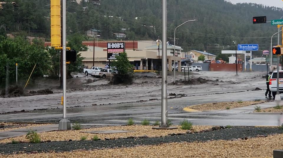 Flood water rushes through a road in Ruidoso, New Mexico, U.S. July 10, 2024, in this screengrab obtained from a social media video.