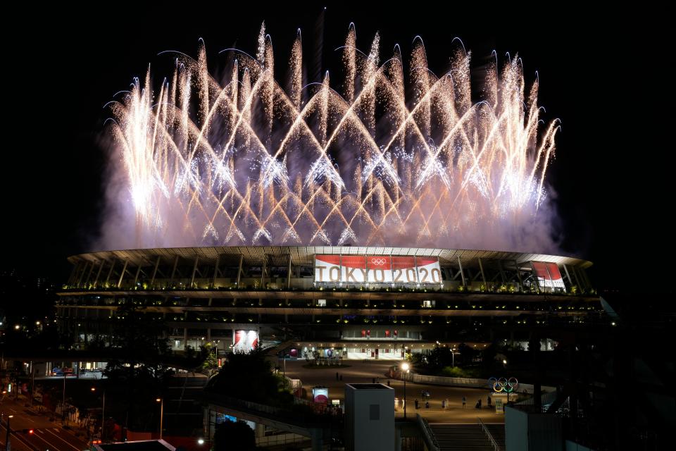 Fireworks illuminate over the National Stadium during the opening ceremony of the 2020 Summer Olympics Friday in Tokyo.