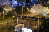 Police block a square during a mass protest following the presidential election in Minsk, Belarus, early Tuesday, Aug. 11, 2020. Thousands of people have protested in Belarus for a second straight night after official results from weekend elections gave an overwhelming victory to authoritarian President Alexander Lukashenko, extending his 26-year rule. A heavy police contingent blocked central squares and avenues, moving quickly to disperse protesters and detained dozens. (AP Photo)