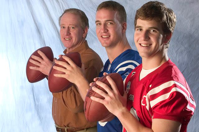 <p>Sporting News via Getty</p> Archie Manning, Peyton Manning and Eli Manning in 2004