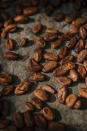 Cocoa beans dry in Divo, West-Central Ivory Coast, November 19, 2023. Chocolate may come with a slightly bitter aftertaste this Easter. Shoppers in Europe, the United States and elsewhere are paying more for their traditional candy eggs and bunnies as changing climate patterns in West Africa take a toll on cocoa supplies and farmers (AP Photo/Sophie Garcia)