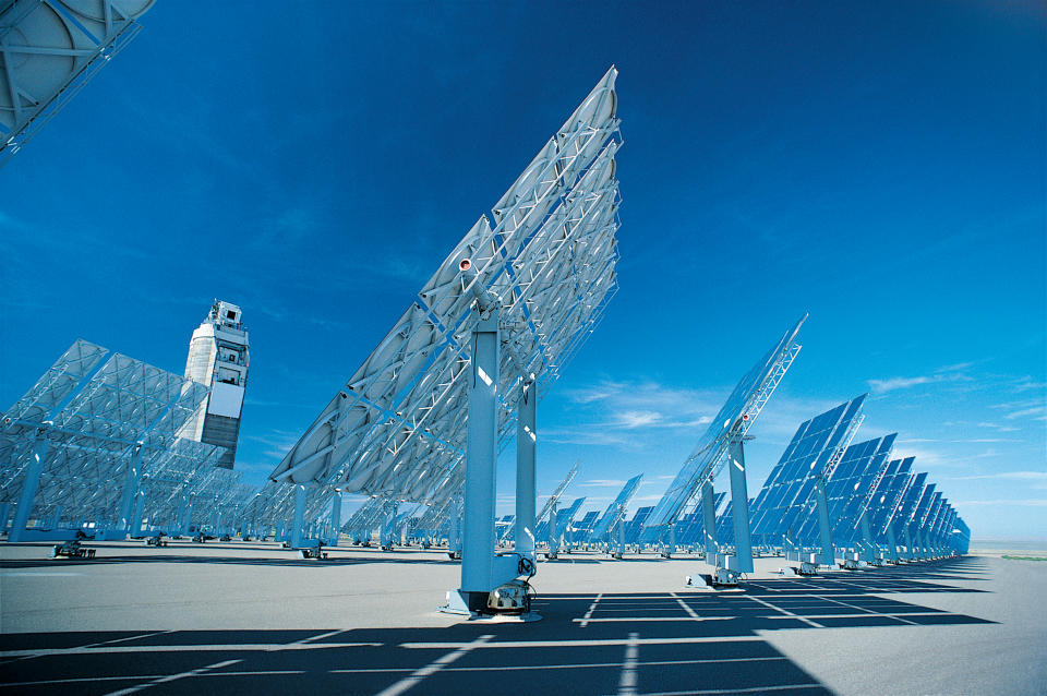 Solar panels with a blue sky in the background.