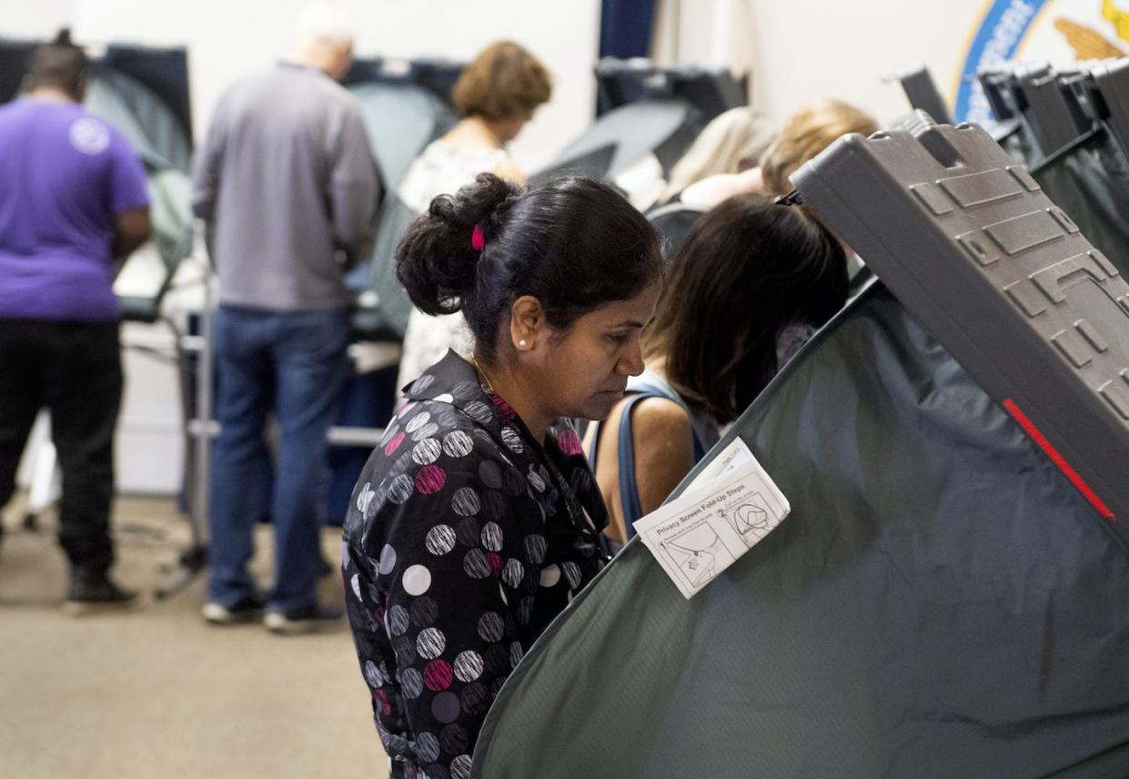 Voters cast ballots in Orange County, Calif., in November 2018. <a href="https://www.gettyimages.com/detail/news-photo/voters-cast-their-ballots-at-deerfield-elementary-school-in-news-photo/1064656452" rel="nofollow noopener" target="_blank" data-ylk="slk:Paul Bersebach/Digital First Media/Orange County Register via Getty Images;elm:context_link;itc:0;sec:content-canvas" class="link ">Paul Bersebach/Digital First Media/Orange County Register via Getty Images</a>