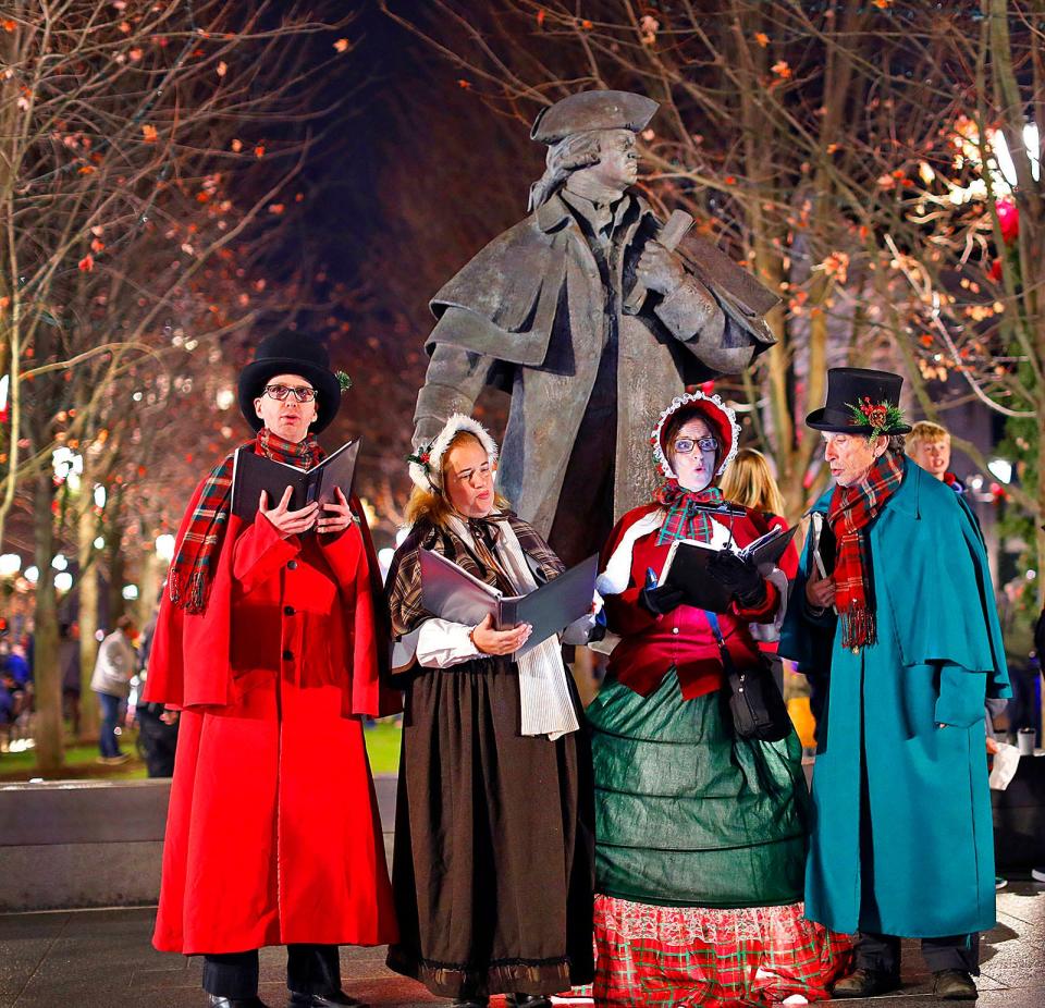 Victorian carolers Grant Yosenick, Katie Duff, Sandee Brayton and David Traugot sing at the annual Quincy Christmas tree lighting Friday, Nov. 25, 2022.