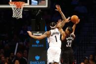 Jan 15, 2017; Brooklyn, NY, USA; Houston Rockets forward K.J.McDaniels (32) shoots the ball against Brooklyn Nets forward Chris McCullough (1) during the second half at Barclays Center. The Rockets won 137-112. Mandatory Credit: Andy Marlin-USA TODAY Sports