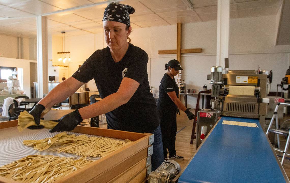 In this file photo Jennifer O’Toole, 44, and Ariel McCoy, 30, prepare pasta at Grace Kitchen in Pasco. The Pasco nonprofit focuses on “empowering and employing women out of poverty.”