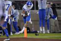 BYU wide receiver Puka Nacua (12) runs the ball for a touchdown against Stanford during the second half of an NCAA college football game in Stanford, Calif., Saturday, Nov. 26, 2022. (AP Photo/Godofredo A. Vásquez)