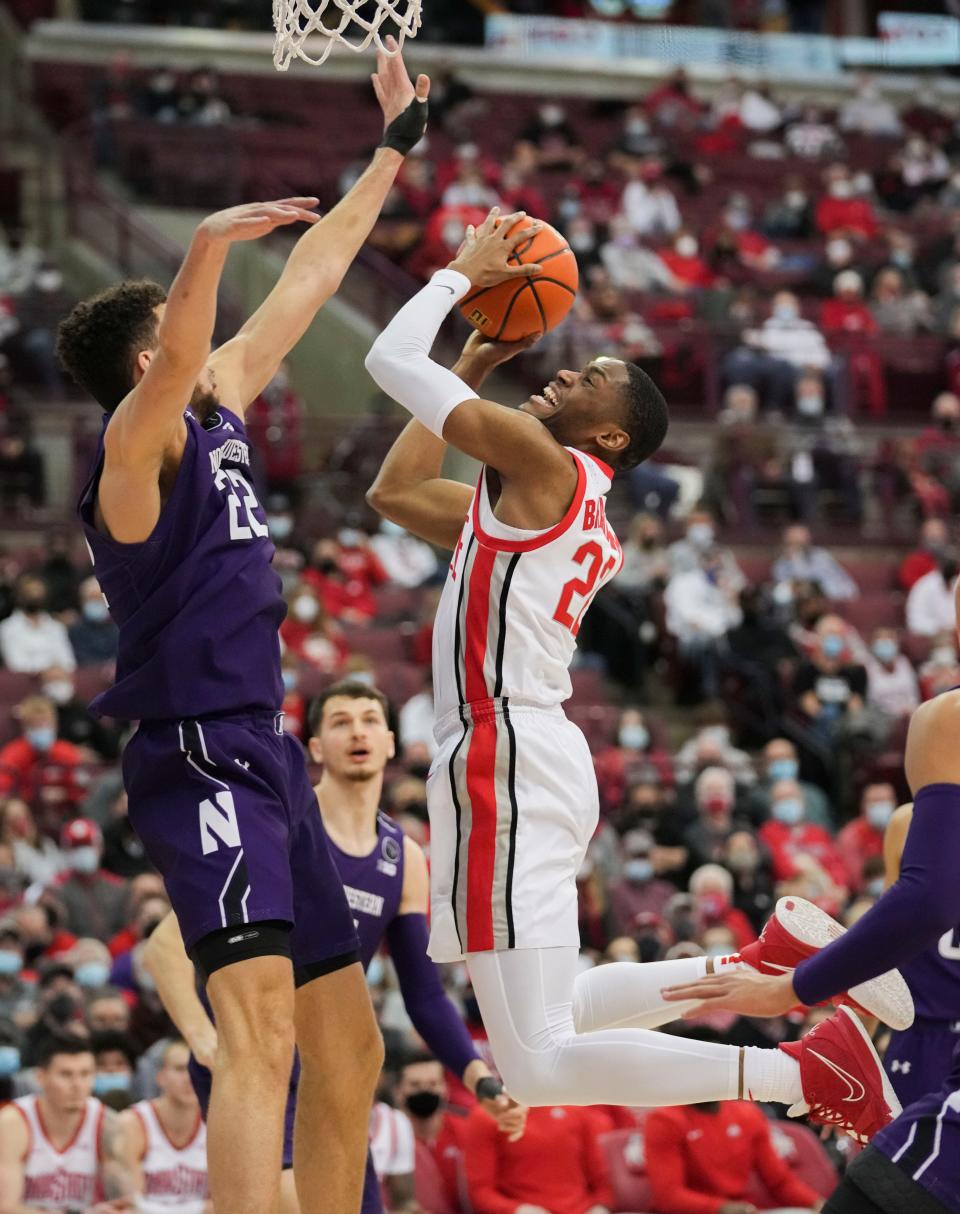Sun., Jan. 9, 2022; Columbus, Ohio, USA; Ohio State Buckeyes guard Malaki Branham (22) rises for a layup attempt as Northwestern Wildcats forward Pete Nance (22) defends during the second half of a NCAA Division I men’s basketball game between the Ohio State Buckeyes and the Northwestern Wildcats at Value City Arena.