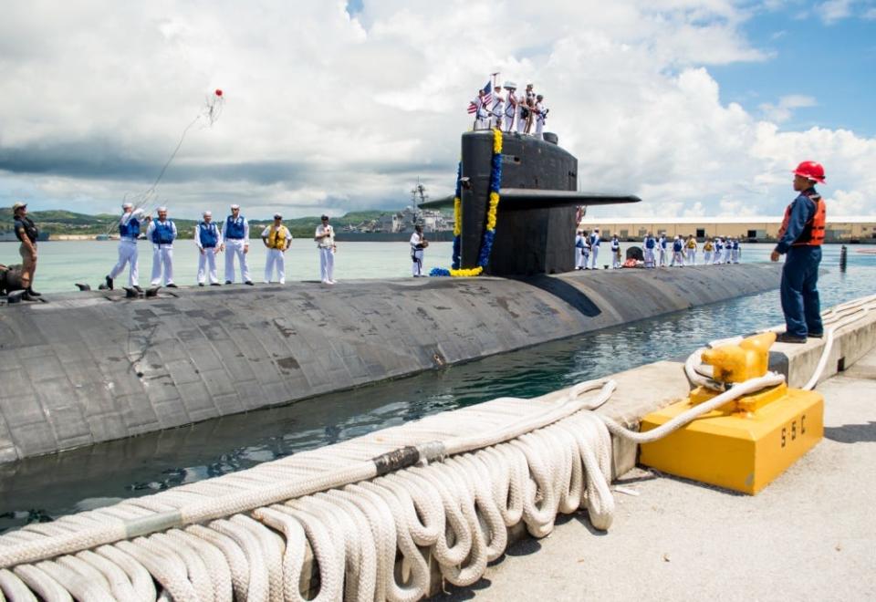 Sailors assigned to the Los Angeles-class fast attack submarine USS Oklahoma City (SSN 723) return from a four-month deployment. Oklahoma City is one of four forward-deployed submarines assigned to Commander, Submarine Squadron Fifteen out of Apra Harbor, Guam.