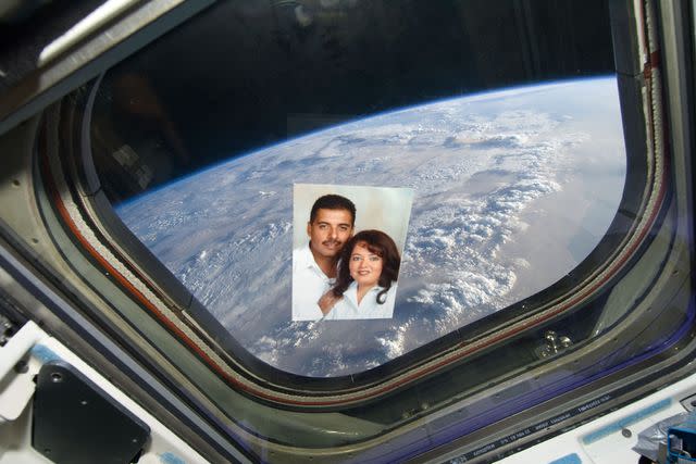 <p>courtesy JosÃ© HernÃ¡ndez</p> A photo of José Hernández and wife Adela aboard the Space Shuttle Discovery