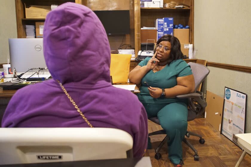 Head nurse Francia Webb talks to a client about abortion options at the West Alabama Women's Center in Tuscaloosa, Ala., on Monday, March 14, 2022. Webb says her experience suffering a miscarriage at five months has given her "a testimony" that she can share with clients considering ending a pregnancy. "By working here, I feel like it's like a blessing. Because I can minister and talk to people in all different kinds of ways, other than just abortion." (AP Photo/Allen G. Breed)