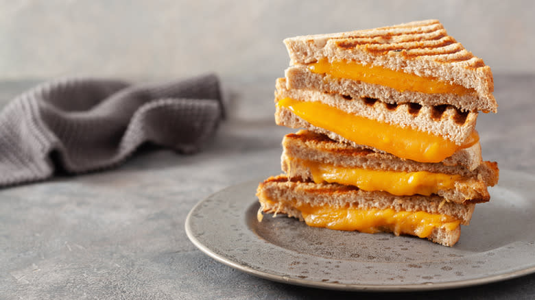 stacked grilled cheese on plate