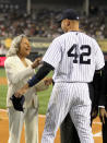 NEW YORK, NY - APRIL 15: Rachel Robinson, wife of Jackie Robinson, welcomes Derek Jeter of the New York Yankees to an on field ceremony prior to their game against the Los Angeles Angels of Anaheim at Yankee Stadium on April 15, 2012 in the Bronx borough of New York City. In honor of Jackie Robinson Day, all players across Major League Baseball will wear number 42(Photo by Nick Laham/Getty Images)