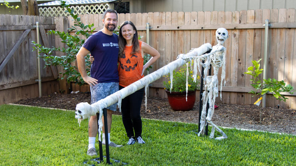 Jay and Jaimie stand near the candy slide they created for Halloween amid the pandemic. (Photo: Jay & Jaimie)