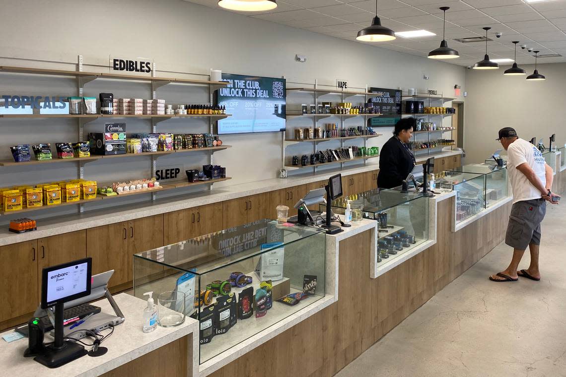 A customer checks out cannabis goods on Monday July 11, 2022, at Embarc, the first cannabis store to open in the city.