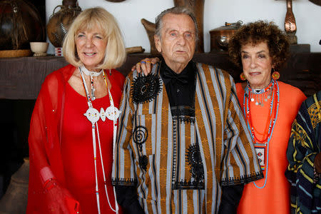Carol Beckwith and Angela Fisher pose with art collector Alan Donovan during a gala marking the launch of their book called "African Twilight: The Vanishing Rituals and Ceremonies of the African Continent" at the African Heritage House in Nairobi, Kenya March 3, 2019. REUTERS/Baz Ratner