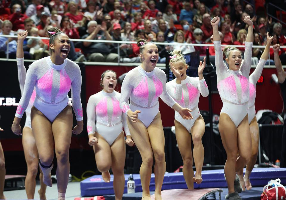 University of Utah gymnasts cheers their teammate on the beam in Salt Lake City on Friday, Feb. 23, 2024.