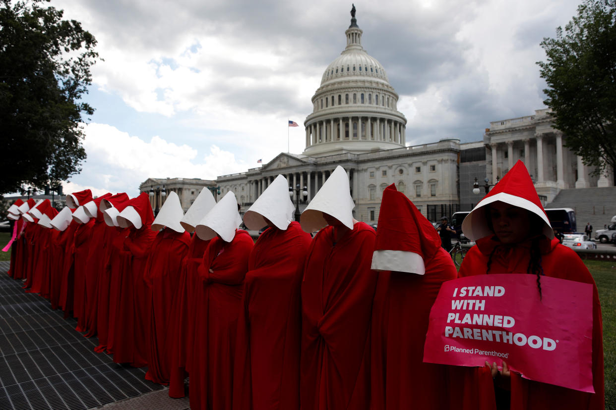 Women dressed as handmaids from "The Handmaid's Tale" demonstrate against cuts for Planned Parenthood in the Republican Senate health care bill at the U.S. Capitol in Washington, D.C., on June 27, 2017. (Photo: Aaron Bernstein / Reuters)