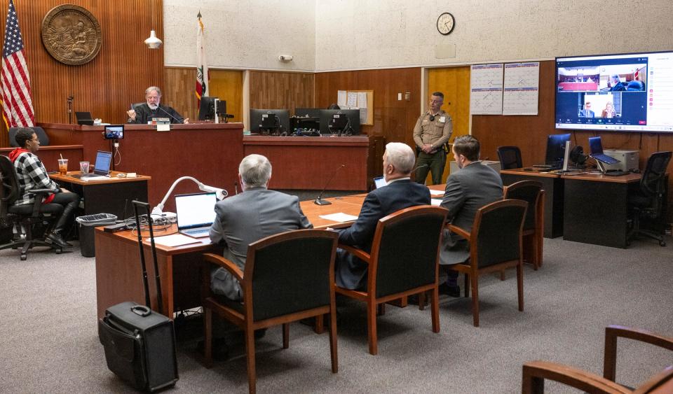 Judge Michael Sheltzer conducts a hearing in Tulare County Superior Court on Friday, February 9, 2024 for the former Healthcare Conglomerate Associates' CEO Dr. Yorai “Benny” Benzeevi, left, and his attorney Nina Marino via Zoom.