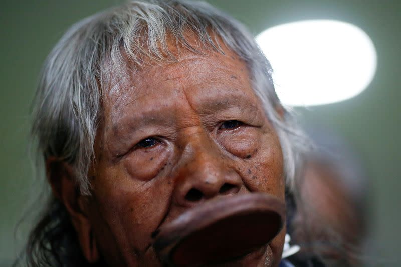 Brazil's indigenous chief Raoni Metuktire speaks with journalists after a meeting with the parliamentary front in defense of the rights of indigenous people in Brasilia