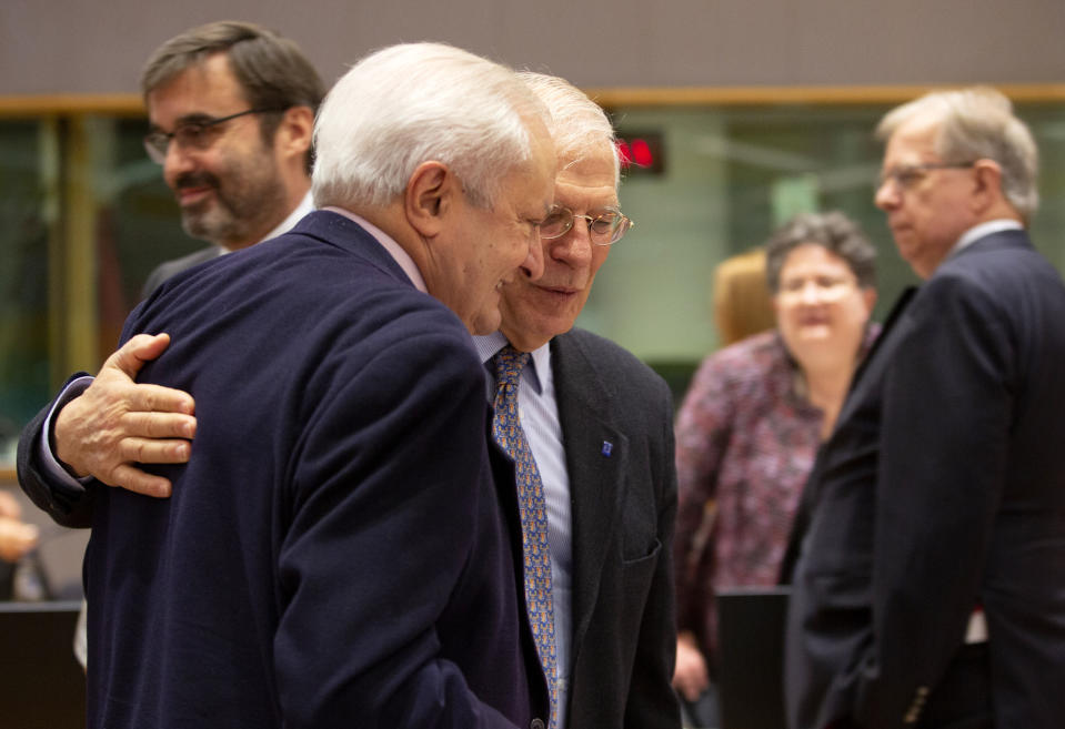 Spanish State Secretary for Foreign Affairs Fernando Valenzuela Marzo, left, speaks with European Union foreign policy chief Josep Borrell during a meeting of EU foreign ministers at the Europa building in Brussels, Monday, Dec. 9, 2019. European Union foreign ministers are debating how to respond to a controversial deal between Turkey and Libya that could give Ankara access to a contested economic zone across the Mediterranean Sea. (AP Photo/Virginia Mayo)