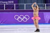 <p>A shirtless man clad in a tutu dances on the rink following the men’s 1,000m speed skating event medal ceremony during the Pyeongchang 2018 Winter Olympic Games at the Gangneung Oval in Gangneung on February 23, 2018. / AFP PHOTO / Mladen ANTONOV </p>