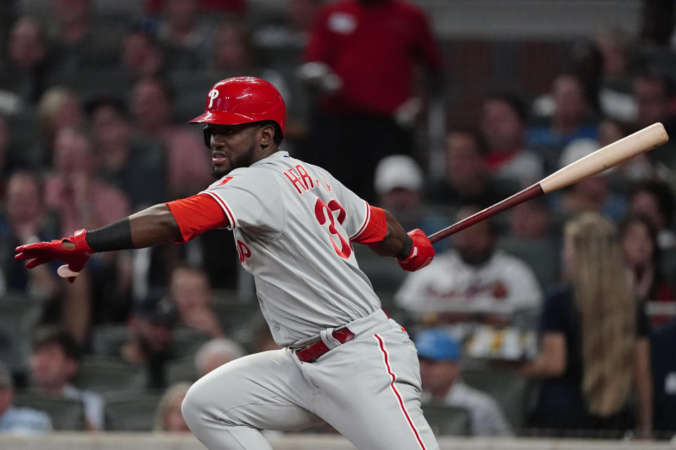 Philadelphia Phillies' Odubel Herrera (37) follows through on a single in the fifth inning of a baseball game against the Atlanta Braves Tuesday, Sept. 28, 2021, in Atlanta. (AP Photo/John Bazemore)