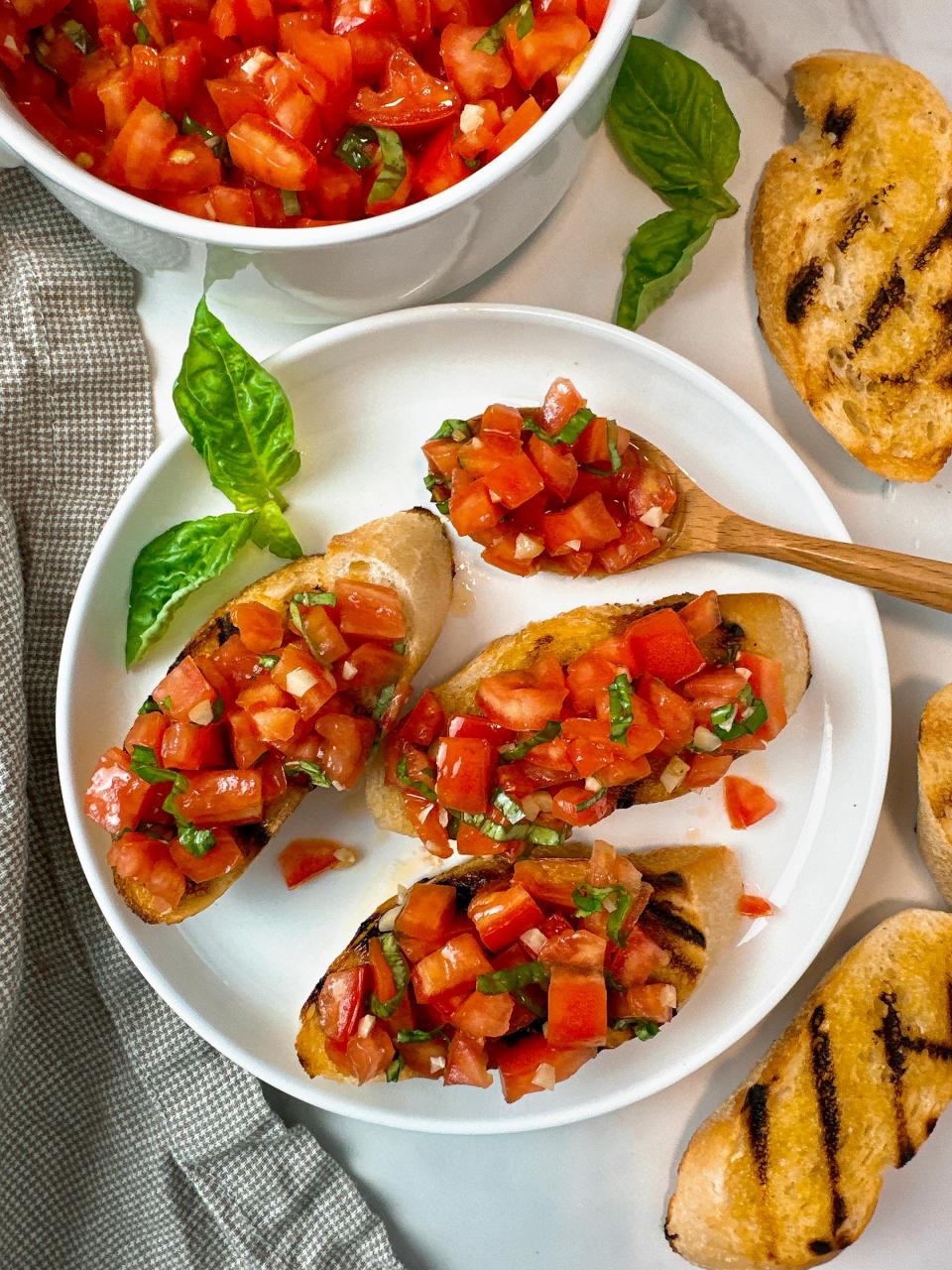 Bruschetta is the ultimate summer appetizer, made with fresh tomatoes, basil, garlic-infused olive oil and crisp bread.