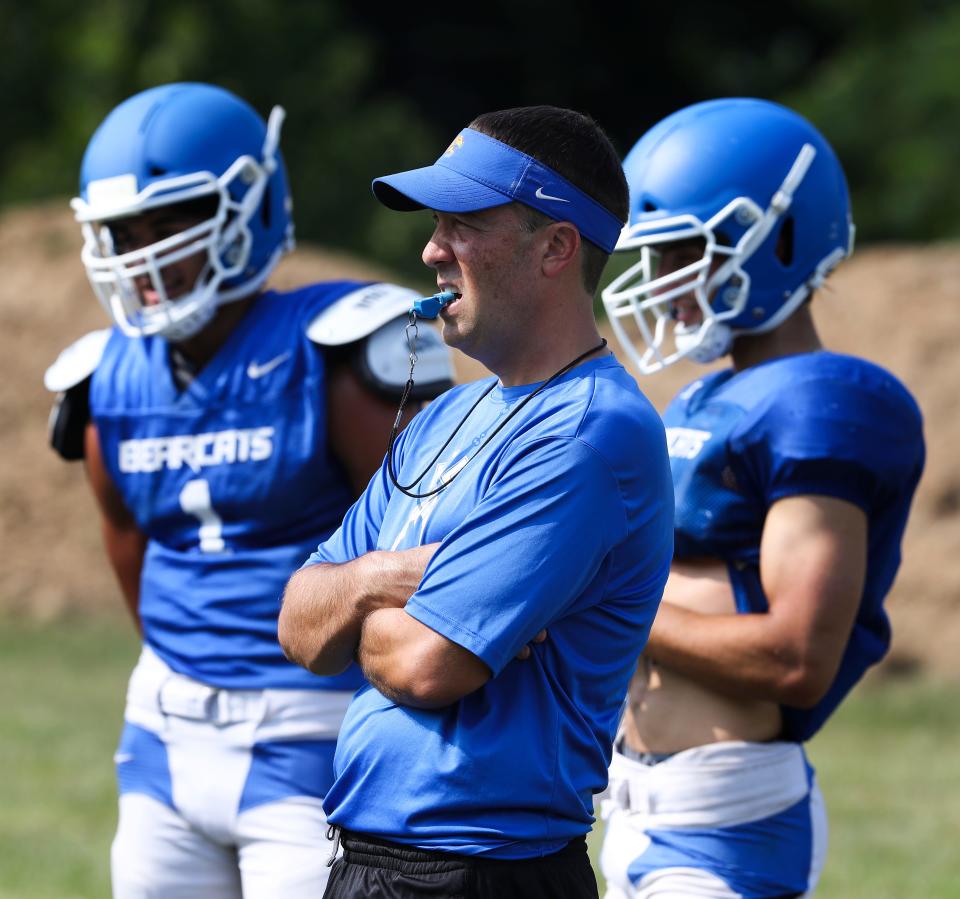 Kentucky County Day head coach Matthew Jones, center, watches practice at the school in Louisville, Ky. on Aug. 4, 2021.  