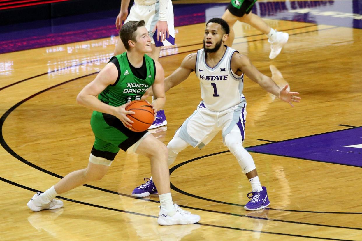 Kansas State's Markquis Nowell (1) guards North Dakota's Brady Danielson (15) Sunday at Bramlage Coliseum. Nowell had five steals in the game as the Wildcats won, 84-42.