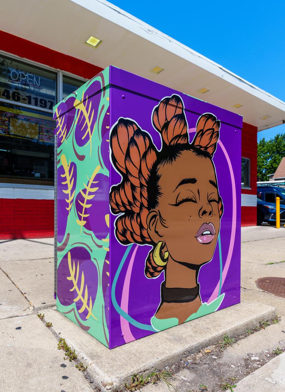 A utility box at 60th & Burnham is wrapped with art by Aaliyah Steele as seen on Friday, July 21, 2023. The box is one of 11 selected for the City of West Allis public art utility box program.