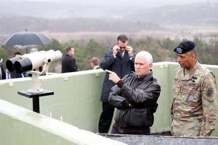 U.S. Vice President Mike Pence looks toward the north from an observation post inside the demilitarized zone separating the two Koreas, in Paju, South Korea, April 17, 2017. REUTERS/Kim Hong-Ji